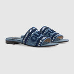 slide sandal with Gucci script in light blue denim 771589